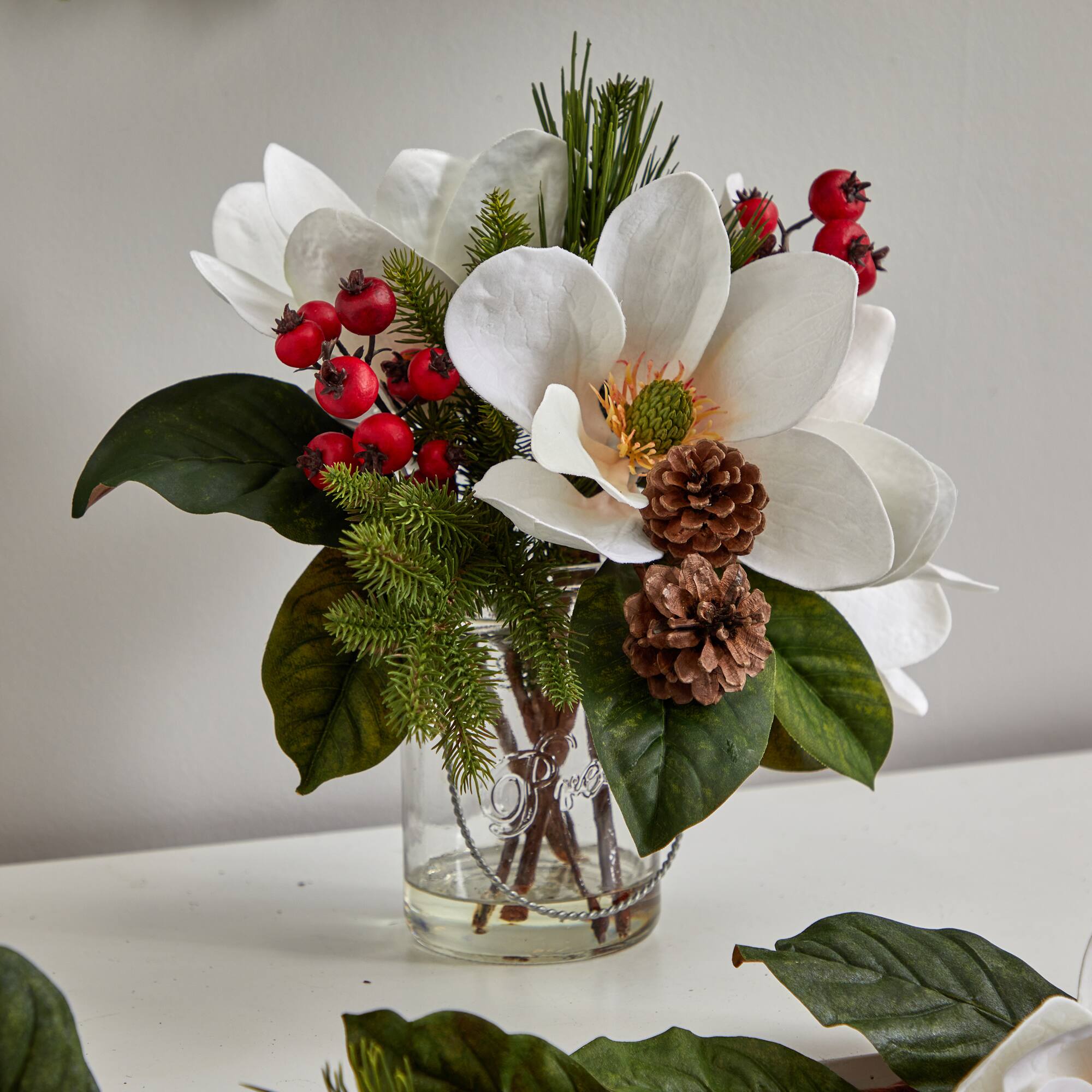12" Magnolia, Pine & Berry Arrangement in Glass Vase